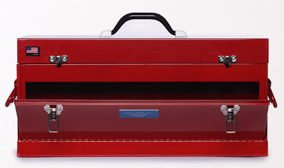 red metal toolbox with front-open drawer