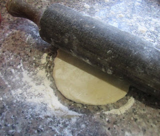 Rolling pin on meat pie dough