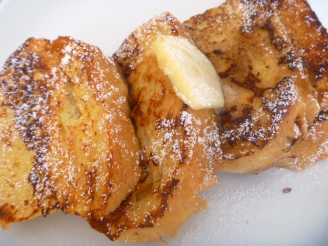 Country French Toast: Light and tender, fluffy thick pieces of country br bead fried to a golden brown, and smothered in real maple syrup - Slice of Southern