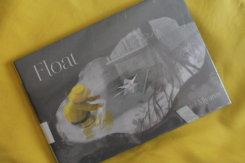 Books and Umbrellas Float by Daniel Miyares