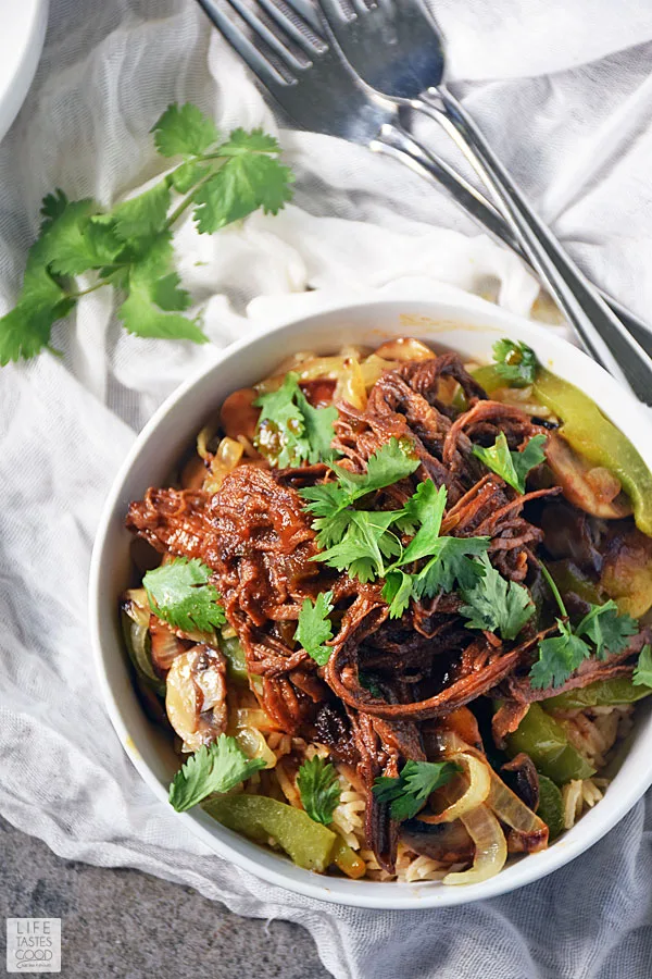 Serve up a deliciously satisfying dinner easily with this Beef Bowl Recipe. Leftover BBQ slow cooker brisket and fresh sauteed vegetables are served a top a bowl of rice and makes an easy dinner recipe everyone will love! #LTGrecipes