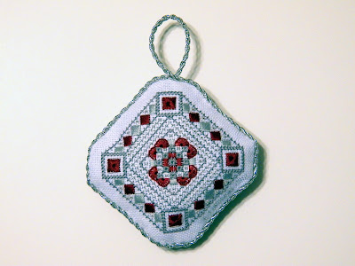 Scarlet and Gray Christmas Ornament, designed and stitched by Erin Turowski 