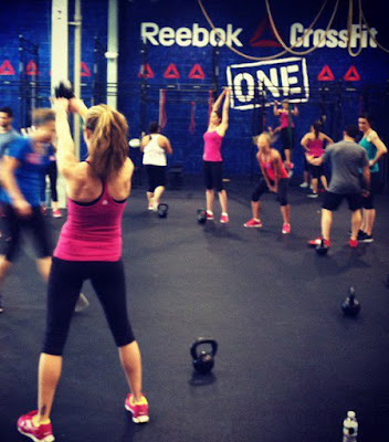 Heather Hart performs kettlebell swings at the  Reebok CrossFit One facility