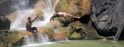 Jump at hot spring pool side Segara Anak Lake of Mount Rinjani