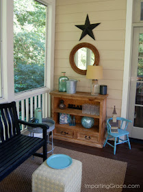 Bookcase cut in half now serves as small sideboard and creates a beverage serving station on screened porch.