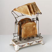 . open flame, antique toasters were fairly dangerous. (antique toaster sliced bread victorian kitchen food appliance history)