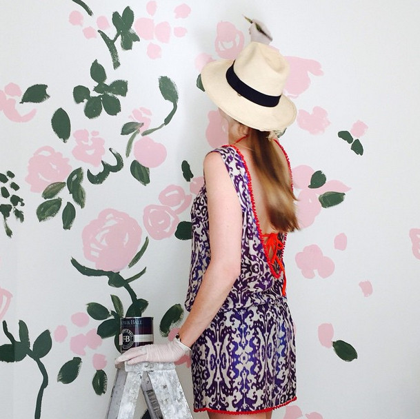 Artist and stylemaker Kate Schelter painting floral mural with Farrow and Ball 