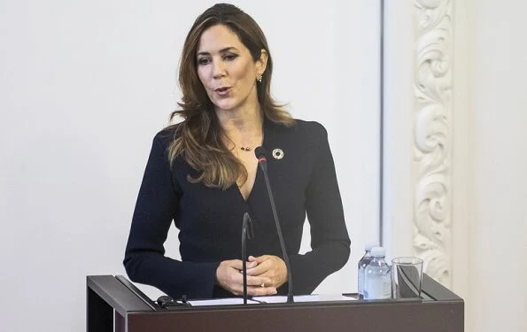 Scanlan Theodore crepe Knit wrap jacket and wide-leg trousers. Crown Princess Mary wore a crepe knit wrap jacket from Scanlan Theodore