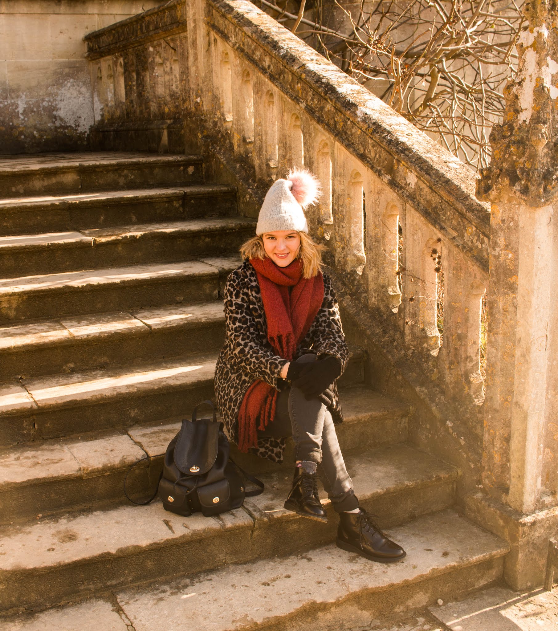 A photo diary from Lacock - blonde blogger girl say outside cathedral