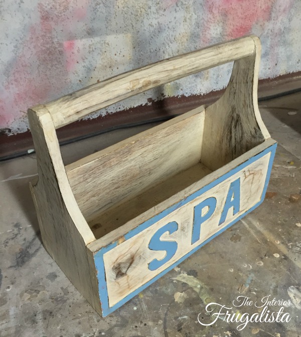 A handmade wooden tool caddy with hand-hewn handle and hand-carved letters upcycled and repurposed from spa caddy to lovely French-inspired garden caddy.