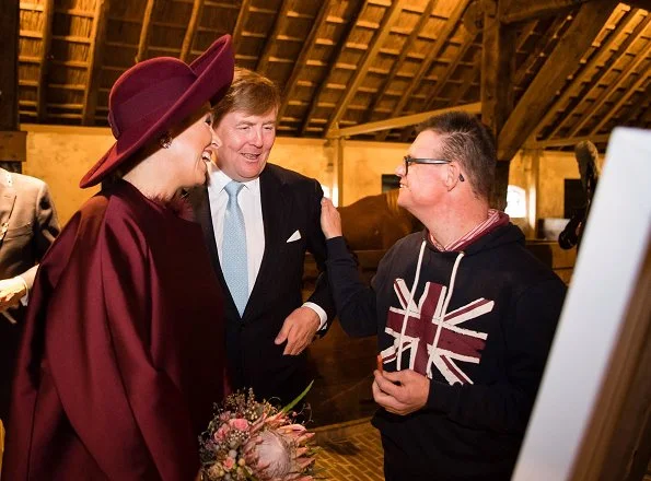 Dutch Queen Maxima wore a new Natan branded silk cape and Natan inlaid design dress.Natan suede Pumps