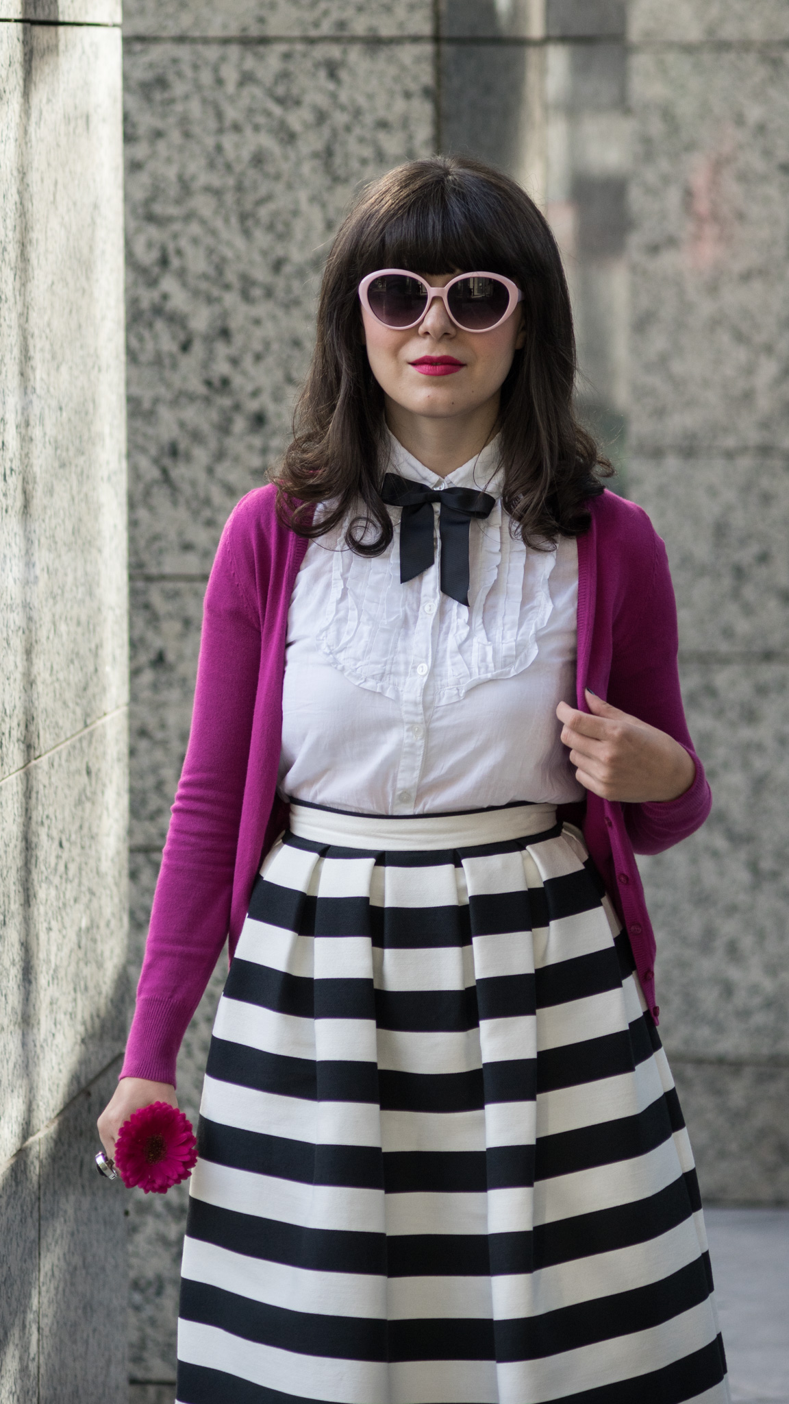 black & white outfit with stripes and pops of pink and fuchsia white shirt black bow tie fuchsia shoes heels sweater C&A striped midi skirt stripes pink thrifted trench black clutch pink cat eye glasses