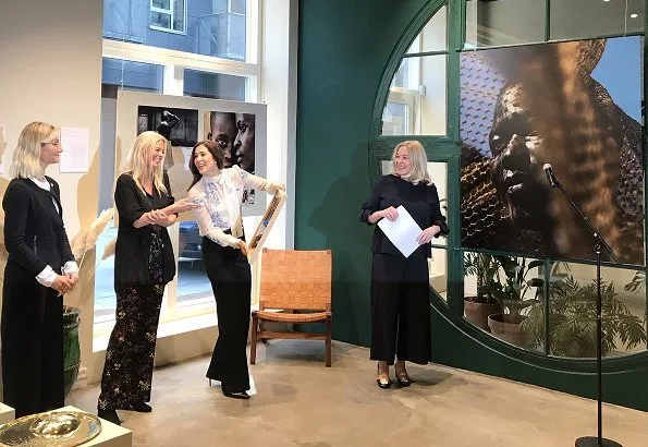 Crown Princess Mary wears Valentino Rockstud patent leather pumps. Photographer Signe Vilstrup portrait exhibition at Yume in Copenhagen