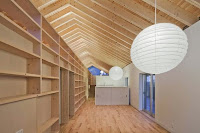 Contemporary House Style With Exposed Timber Rafter And Bookshelf Column