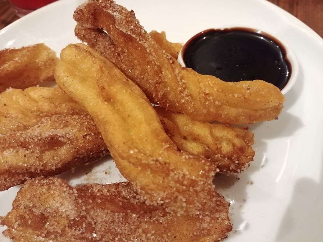 Churros with chocolate dip from the dessert station of The Grand Kitchen