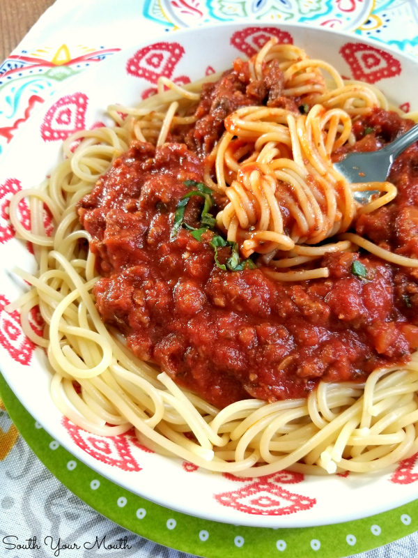 Homemade Spaghetti with Meat Sauce | A hearty classic Italian pasta sauce recipe made from scratch with sausage and ground beef. Easily cut this BIG BATCH recipe in half or make a whole pot for feeding a crowd or stocking your freezer with an easy weeknight meal.