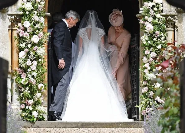 Duchess Catherine, her children Prince George of Cambridge, page boy and Princess Charlotte of Cambridge, flower girl attend the wedding of Pippa Middleton