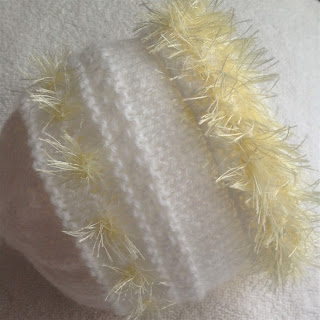 https://www.craftsy.com/knitting/patterns/fluffy-easter-baby-beanie-hat/238259
