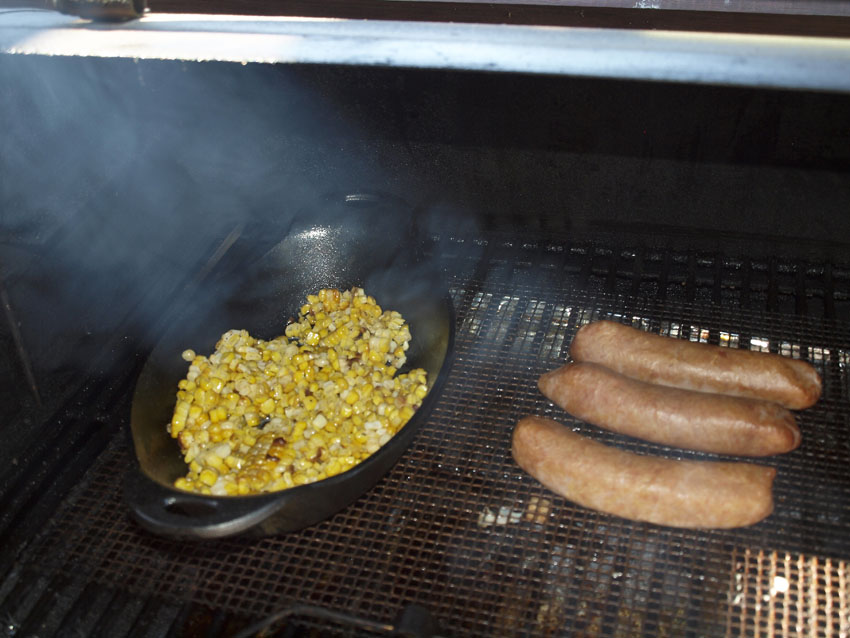 Pellet Smoker Cooking Smoked Sauerkraut Brats on the Griddle