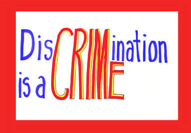 A handwritten sign that says discrimination is a crime.