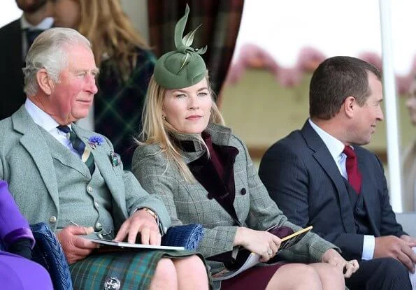 Queen Elizabeth, The Prince of Wales and Duchess of Cornwall, Autumn Phillips and Peter Phillips. Camilla wore a red wool coat by Burberry