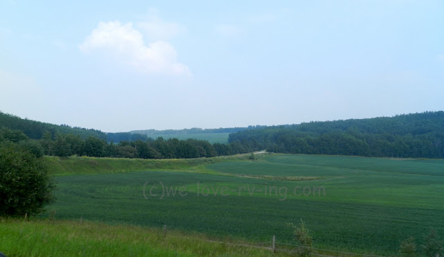 The green fields spread out before us on the road to Beatton, BC