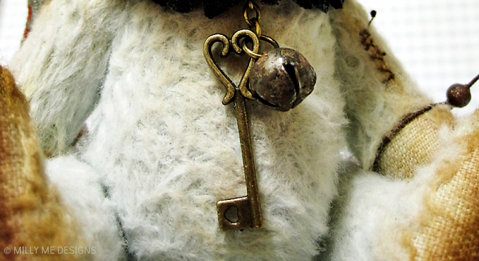 viscose clown teddy bear, heart key, rusty bell