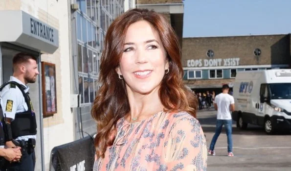 Crown Princess Mary wore a printed silk midi dress by H&M and Prada pumps, she carried Prada Saffiano cuir double bag