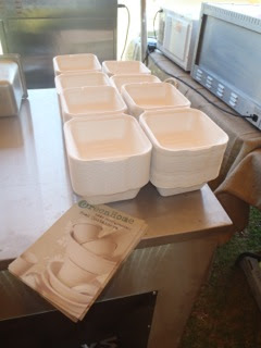 Close up of biodegradable bagasse takeaway clamshells on a market stall counter