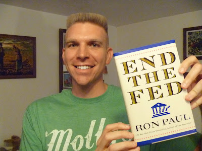 Timothy McGaffin II holding End the Fed by Ron Paul