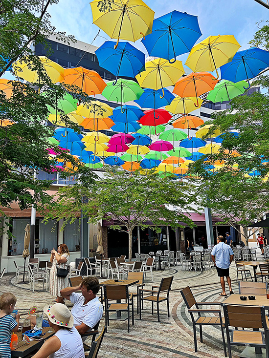 Coconut Grove Grapevine Giralda Plaza shows off colorful Umbrella Sky