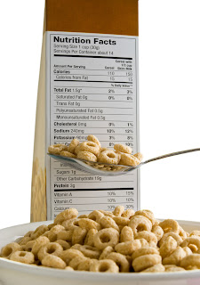 bowl of cereal and cereal box with Nutrition Facts label