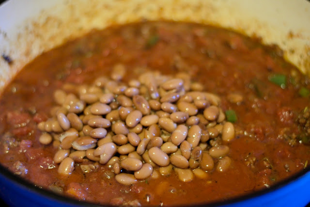 Beans being added to the pot. 