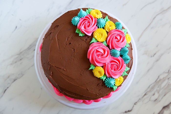 Tips for Frosting Cakes, like this floral cake | bakeat350.net for The Pioneer Woman Food & Friends