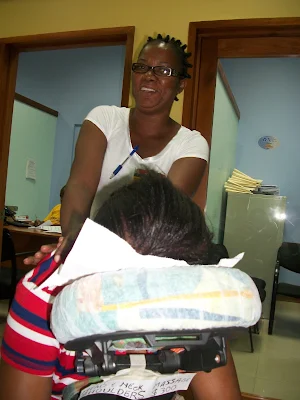 Therapist rendering chairback massage ,at mobay credit union
