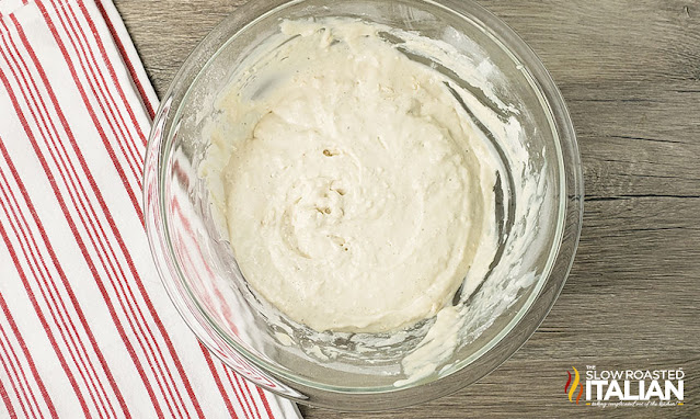 Ice cream bread batter in a large glass mixing bowl