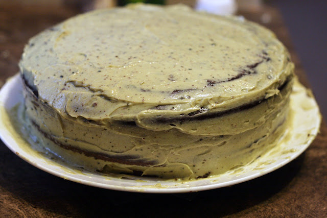 A chocolate cake covered with matcha buttercream