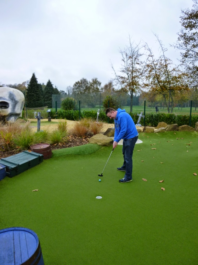 Matt holes out on the very long par-5 third-hole at Pirate Island Adventure Golf course at Hoebridge Golf Centre in Woking, Surrey Pirate Island Adventure Golf course at Hoebridge Golf Centre in Woking, Surrey