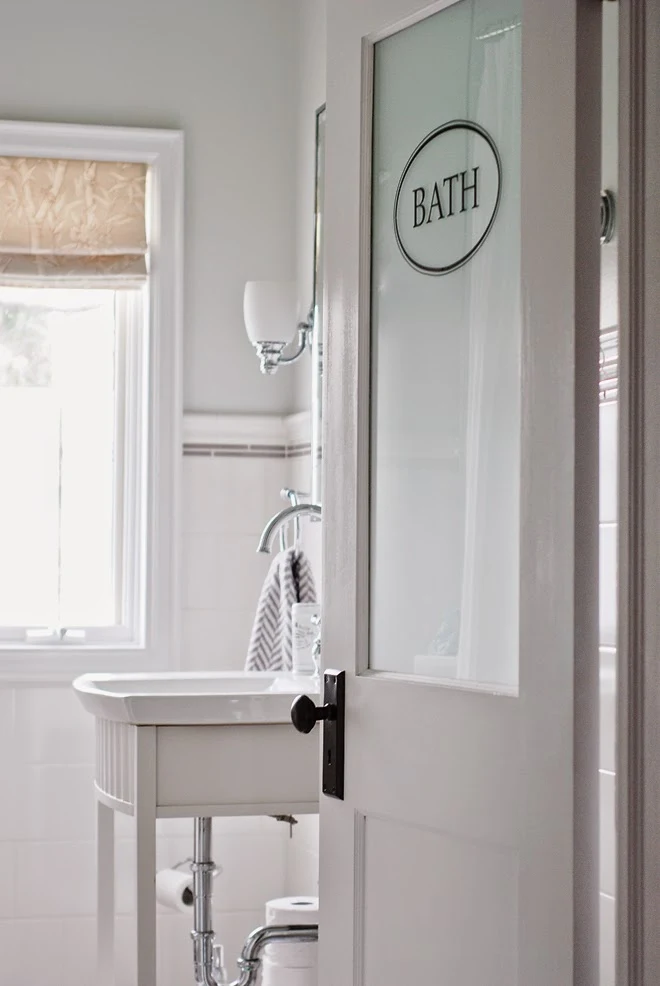 Rambling Renovators | new traditional bathroom black white frosted door