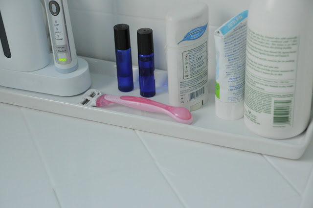 Use a candle dish to organize bathroom essentials :: OrganizingMadeFun.com