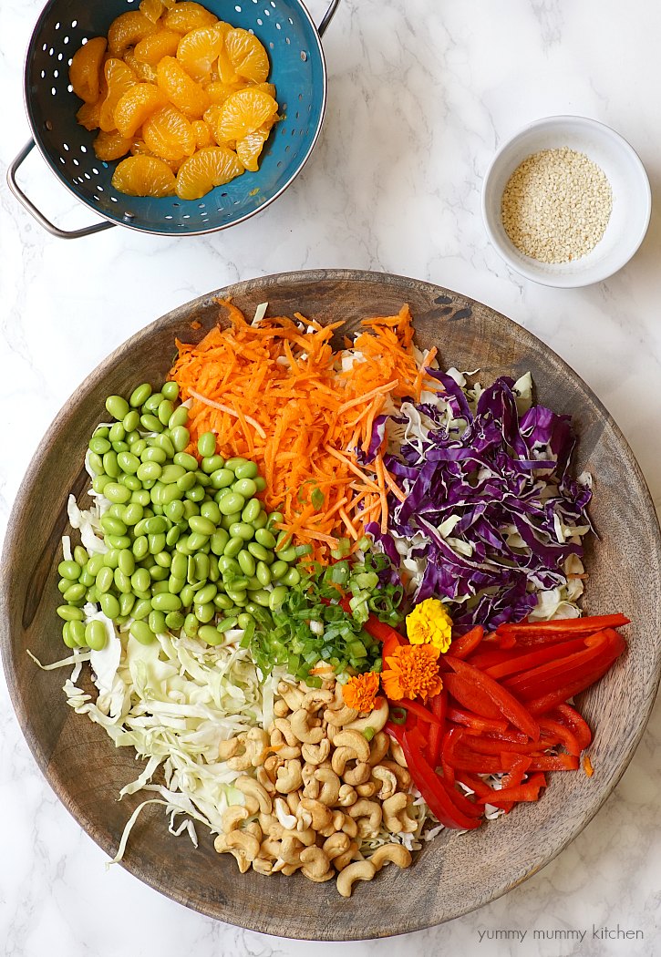 Colorful Chinese inspired vegetarian salad recipe This colorful vegetarian Chinese inspired salad has edamame, cashews, cabbage, mandarin oranges, and a delicious light sesame ginger dressing.
