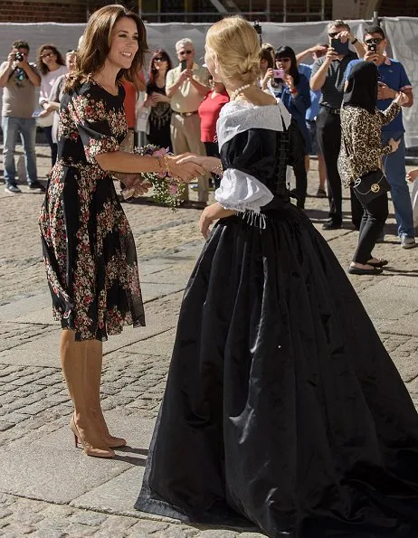 Crown Princess Mary wore Dolce & Gabbana Floral Panel Dress, Naledi Copenhagen Allana Latte Ostrich Clutch, photographer Marco Grop