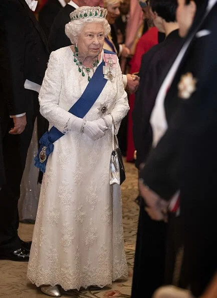 Kate Middleton wore a velvet Alexander McQueen gown, the Lover's Knot tiara, the Nizam of Hyderabad necklace