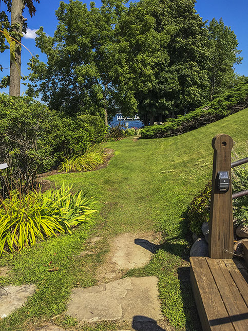 Along the Lake Geneva Lake Shore Path in Lake Geneva Wisconsin mowed grass trail in yard