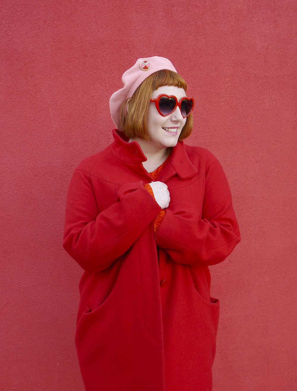 Brightening up winter dressing with a red and pink outfit Scottish blogger Helen of Wardrobe Conversations keeps warm in a red coat