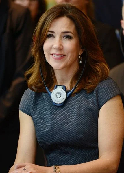 Crown Princess Mary attended the opening of OECD forum at Oecd Conference Centre in Paris. wore Prada dress Gold earrings