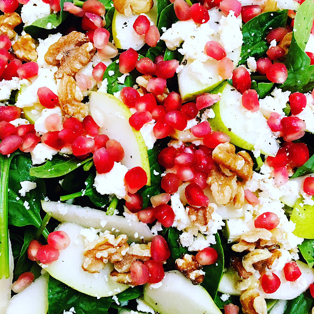 Festive salad Spinach salad with pomegranate, feta, pear and walnut