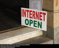 doorway with sign saying "Internet Open"