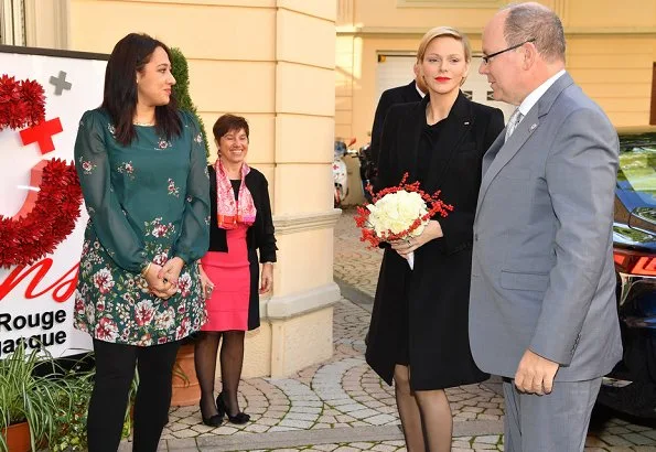 Prince Albert and Princess Charlene distributed gifts to beneficiaries of the Monaco Red Cross on the occasion of the national holiday