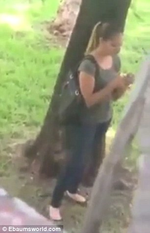 Girl caught on camera taking a picture of her derriere in public park
